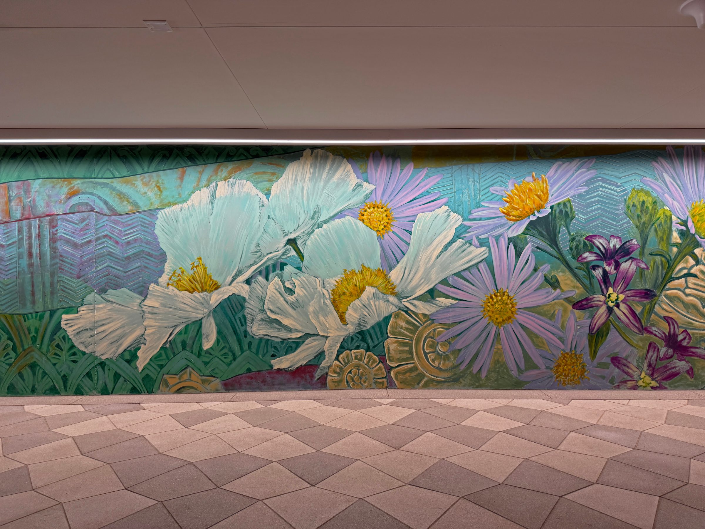 Section of the "Flourishing Structures" mural at Bloom on Third with large white poppies, purple asters and blue irises