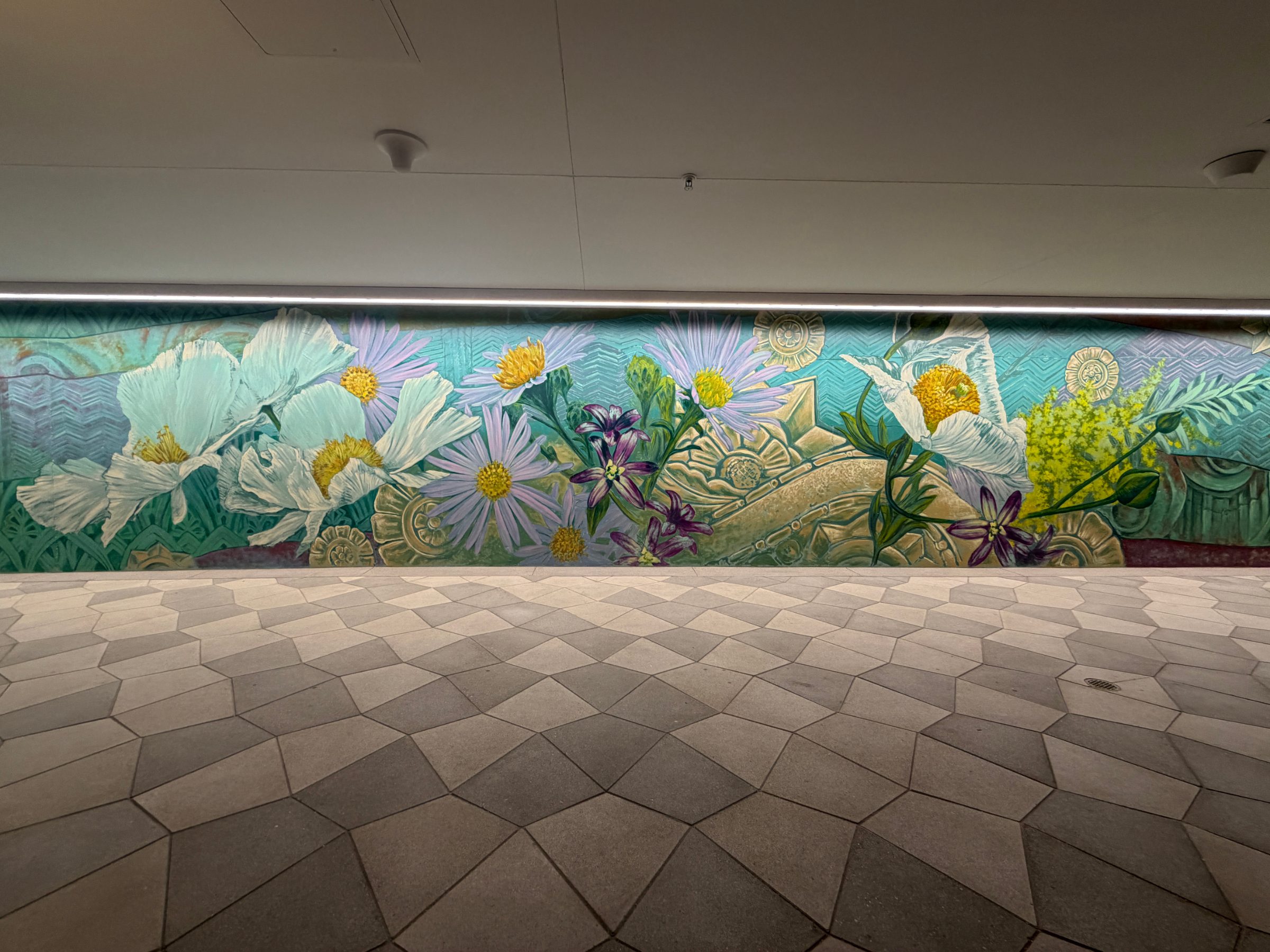 Central flowers section of the "Flourishing Structures" mural at Bloom on Third, with white poppies, purple asters and green foliage
