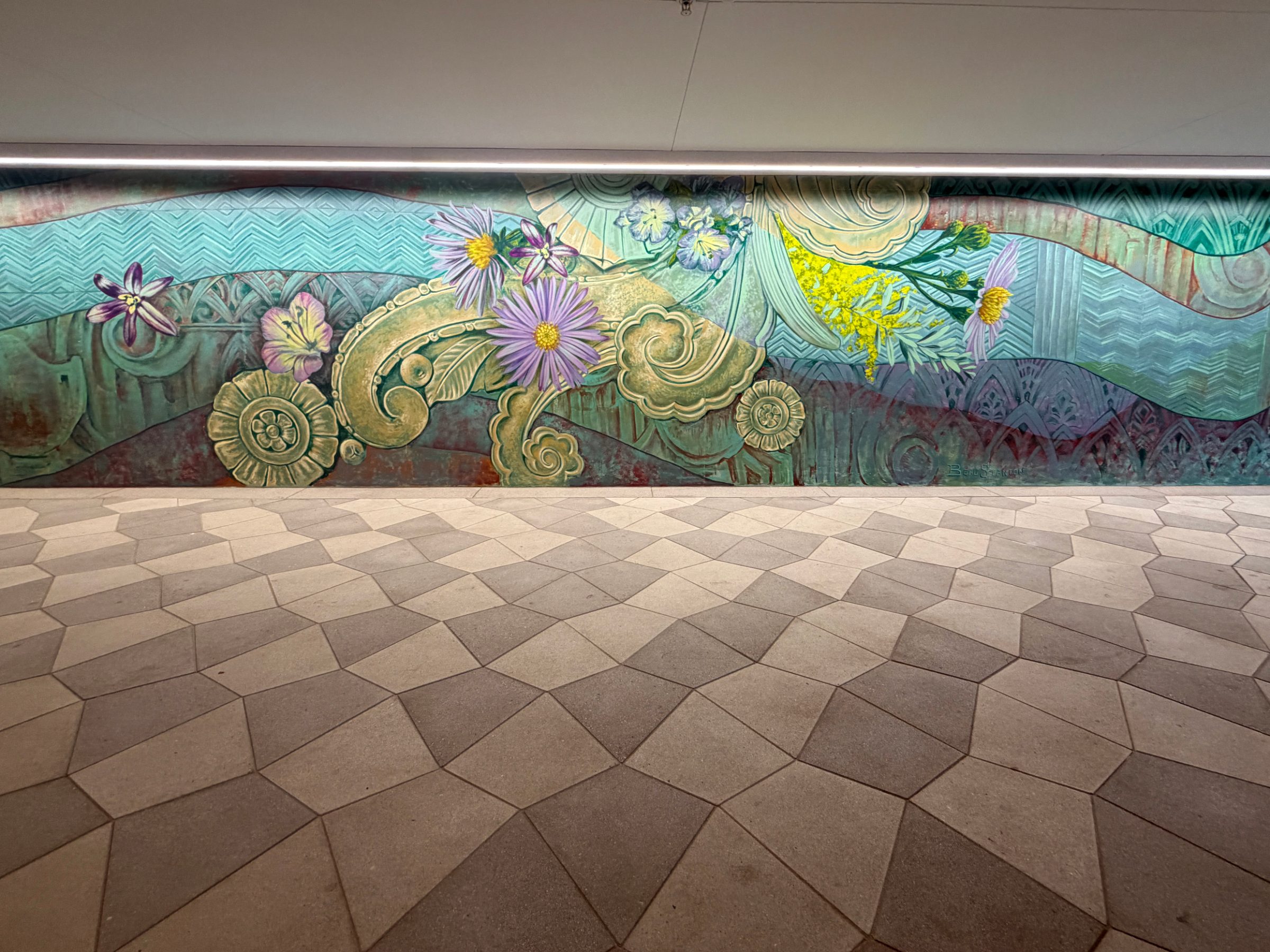 East flourishes section of the "Flourishing Structures" mural at Bloom on Third, with gold scrollwork and purple asters on teal